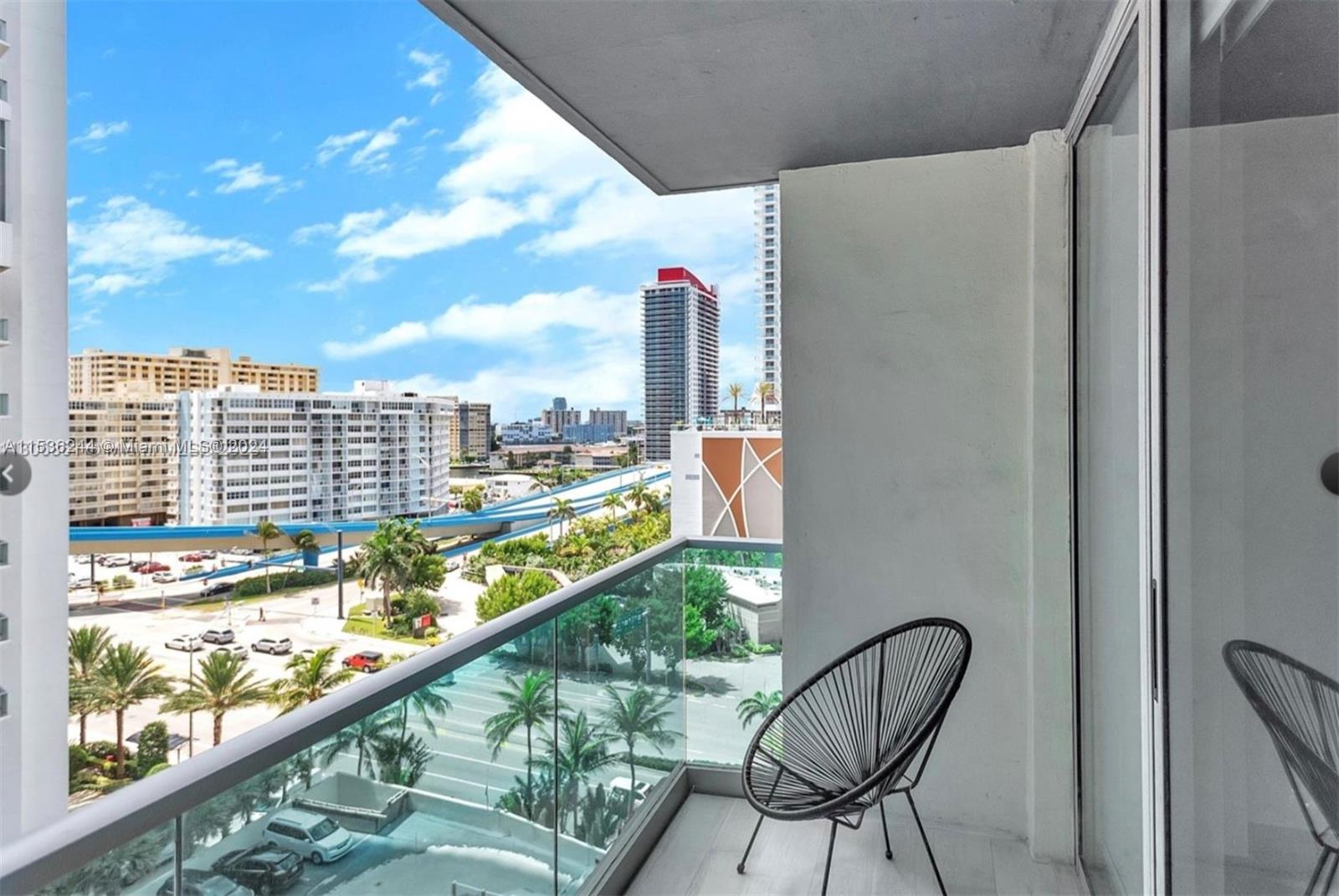 4001 South Ocean Drive, Unit 9F Hollywood, FL 33019 - Photo 3 of 25 a view of a balcony with chair and table