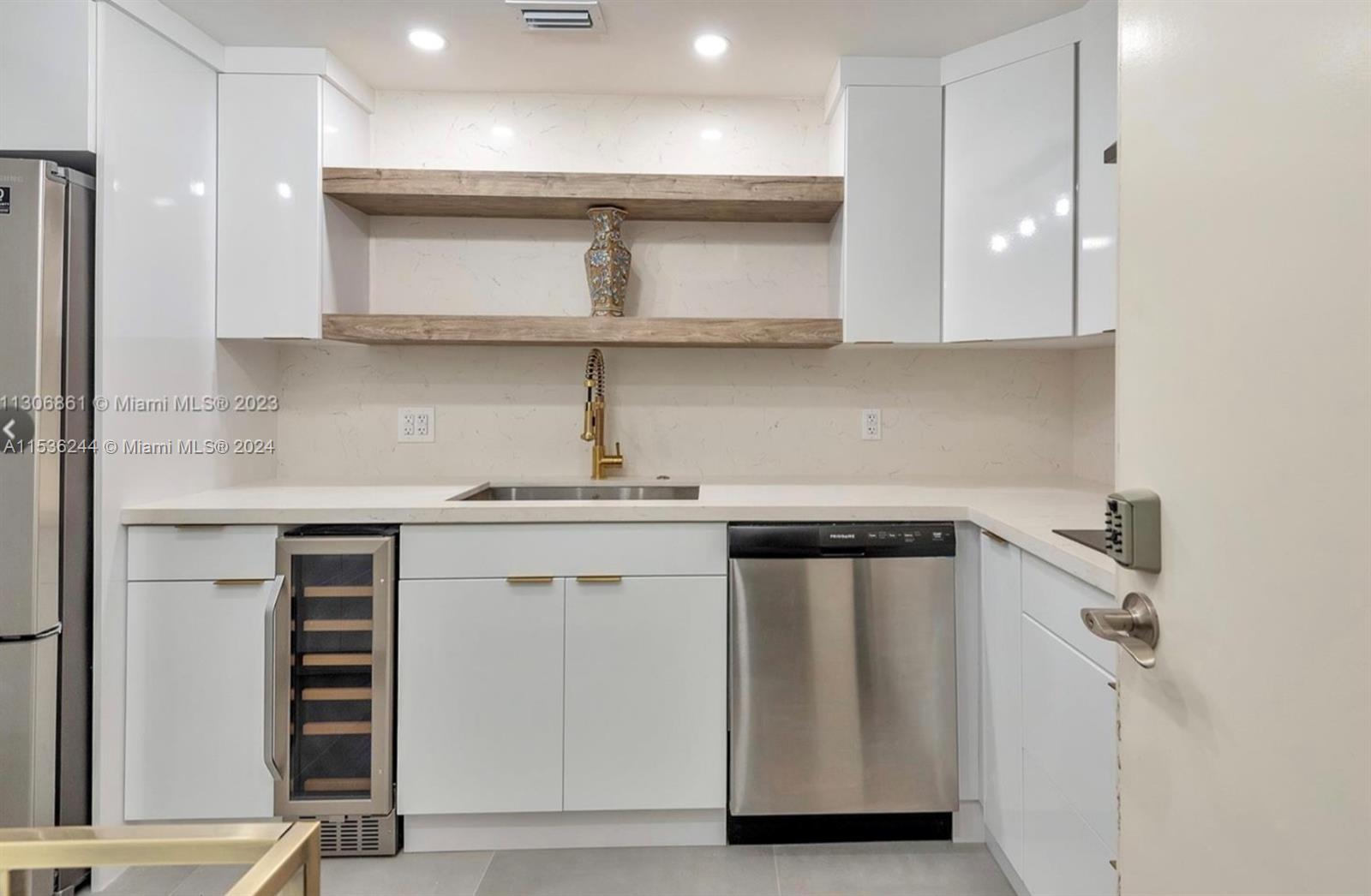 4001 South Ocean Drive, Unit 9F Hollywood, FL 33019 - Photo 5 of 25 a kitchen with a white cabinets and sink