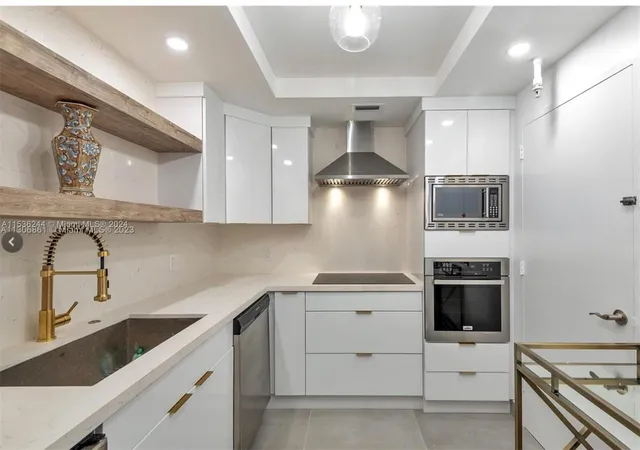a kitchen with a stove sink and refrigerator