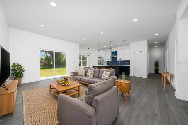 a living room with furniture and a large window