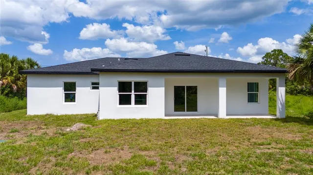 a front view of a house with yard