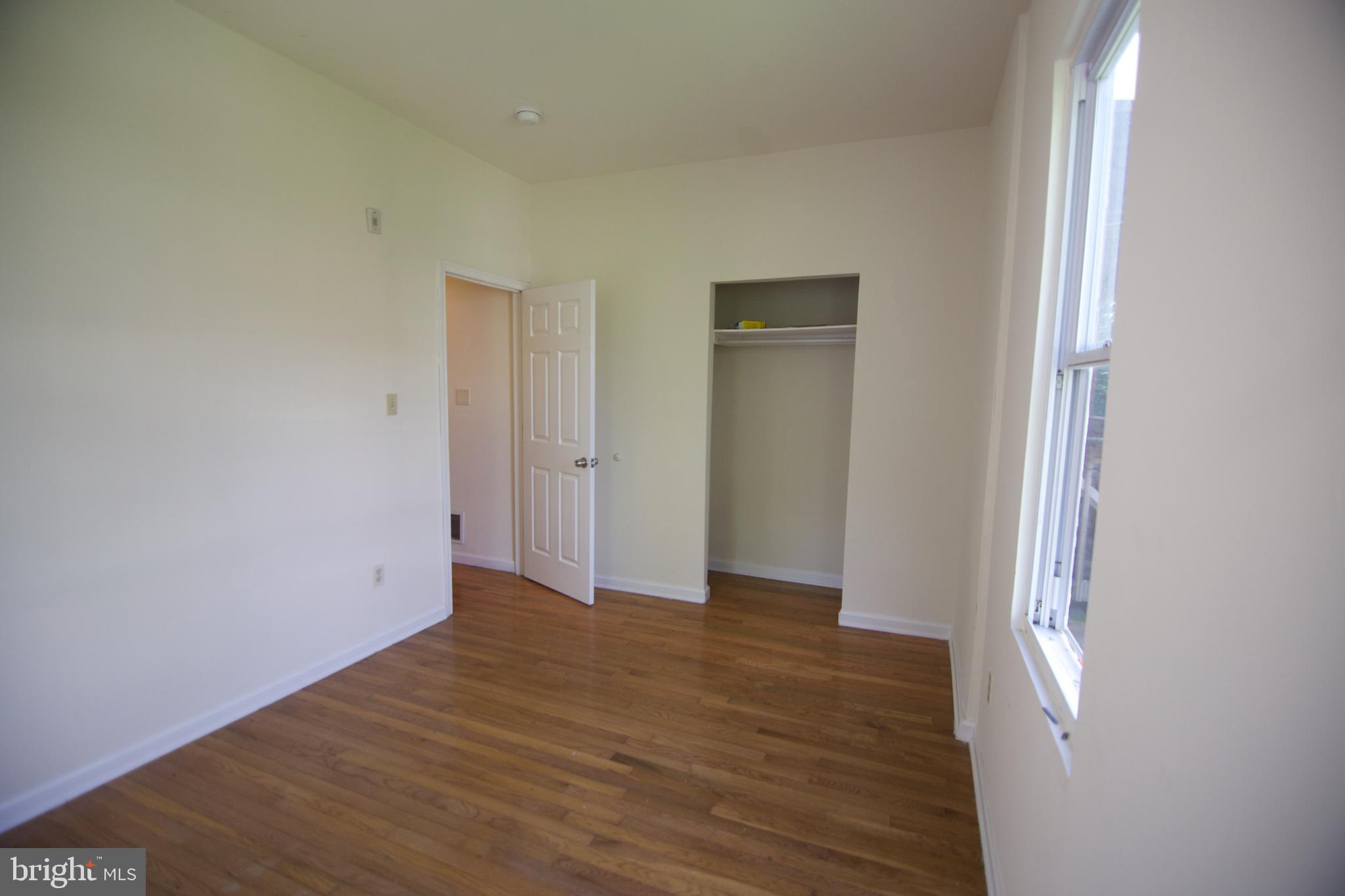 1522 North 17th Street, Unit 2 Philadelphia, PA 19121 - Photo 10 of 10 a view of an empty room with wooden floor and closet