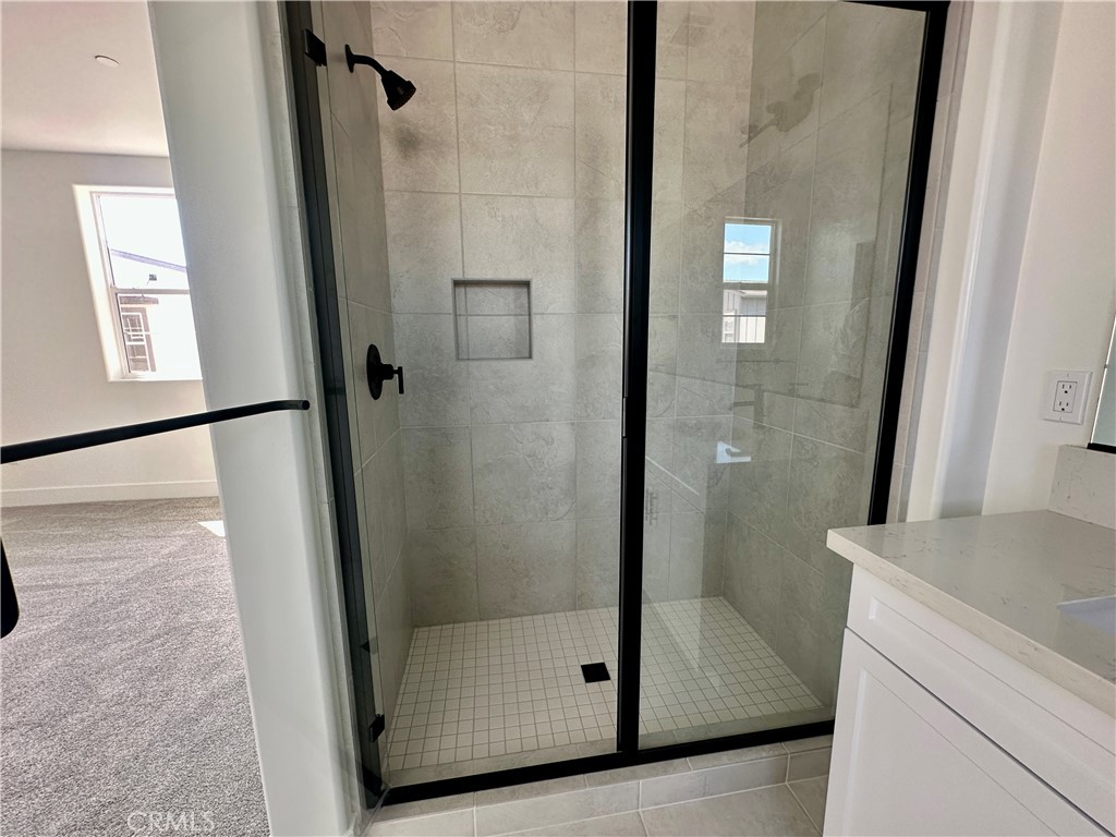 189 Cessna Court San Luis Obispo, CA 93401 - Photo 11 of 13 a bathroom with a shower and mirror