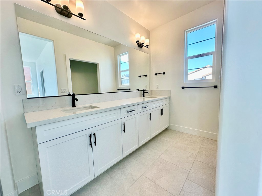 189 Cessna Court San Luis Obispo, CA 93401 - Photo 13 of 13 a spacious bathroom with a double vanity sink a mirror and a