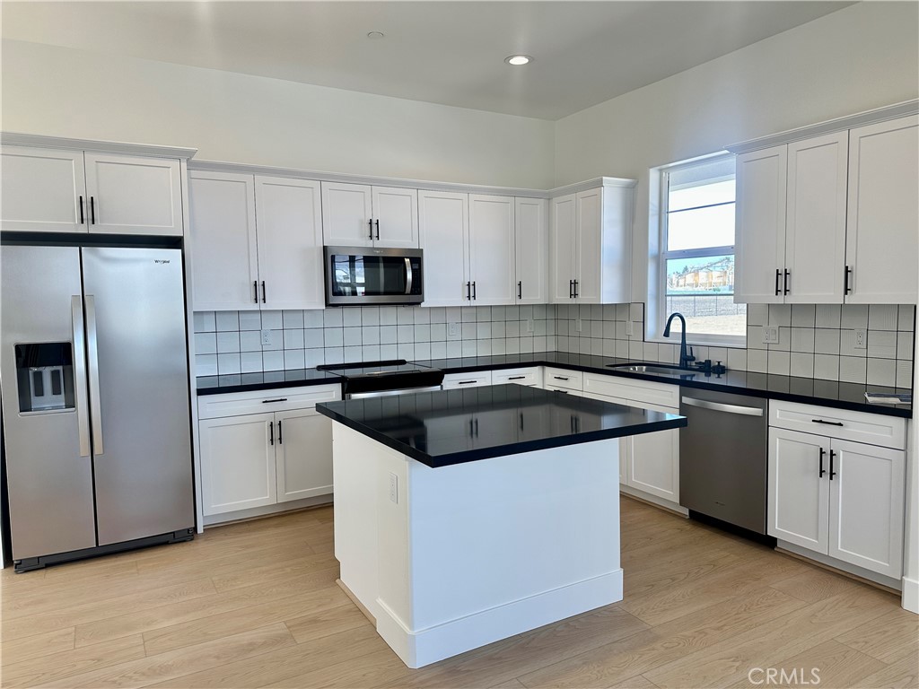 189 Cessna Court San Luis Obispo, CA 93401 - Photo 6 of 13 a kitchen with stainless steel appliances granite countertop a stove a sink and a refrigerator