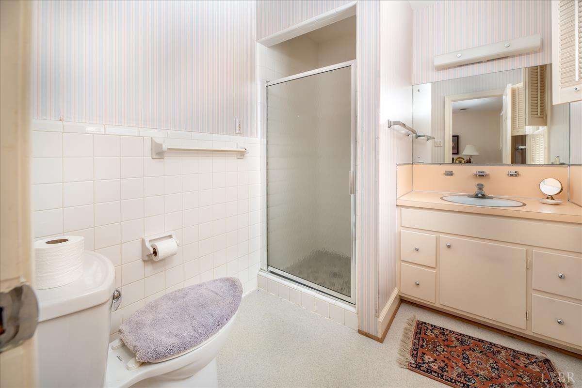 1086 Redfields Road Appomattox, VA 24522 - Photo 14 of 33 a bathroom with a sink a toilet and shower