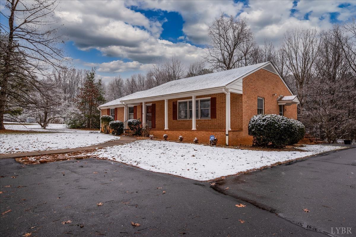 1086 Redfields Road Appomattox, VA 24522 - Photo 3 of 33 a front view of a house with a yard