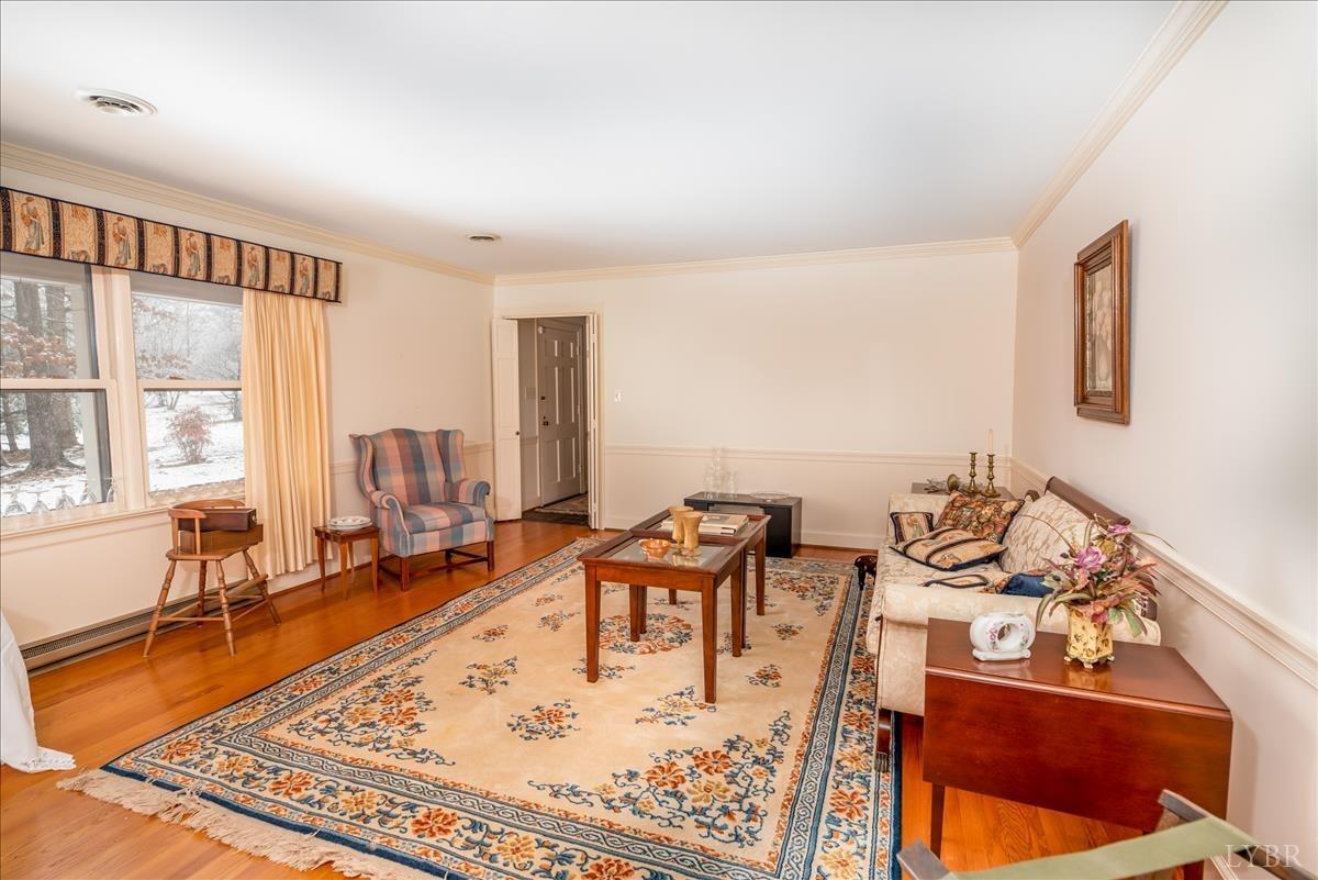 1086 Redfields Road Appomattox, VA 24522 - Photo 6 of 33 a living room with furniture large window and a table