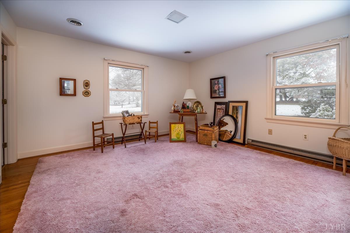 1086 Redfields Road Appomattox, VA 24522 - Photo 9 of 33 a view of a livingroom with workspace and a window
