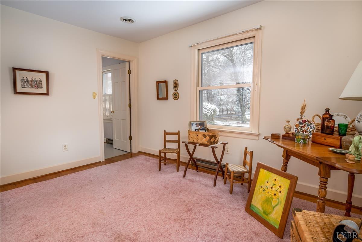 1086 Redfields Road Appomattox, VA 24522 - Photo 10 of 33 a view of a livingroom with furniture and windows
