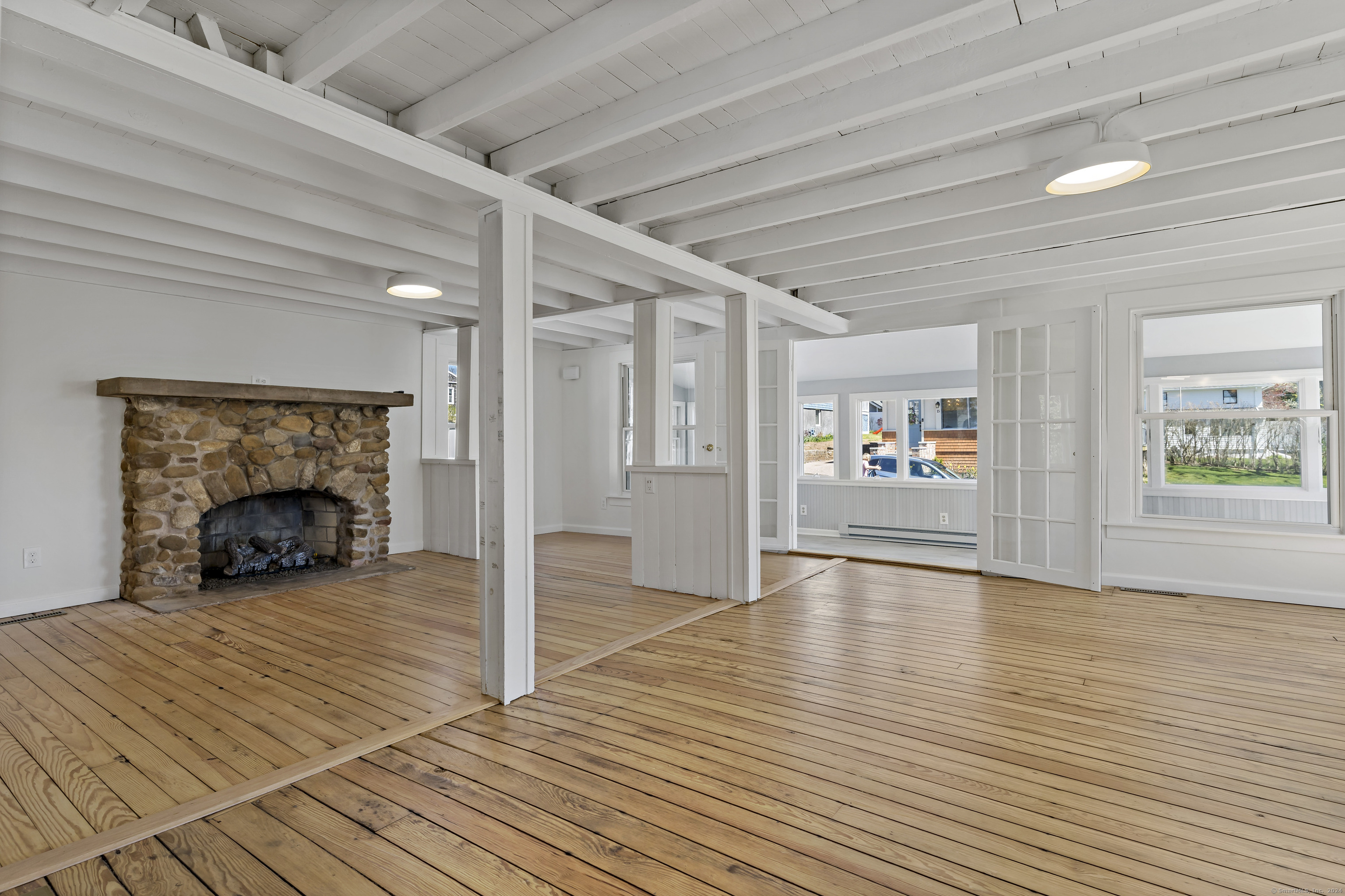 14 2nd Avenue Branford, CT 06405 - Photo 12 of 29 a view of an empty room with window and wooden floor