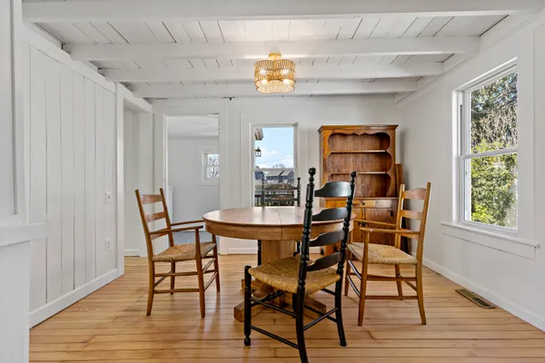 a dining room with furniture and window