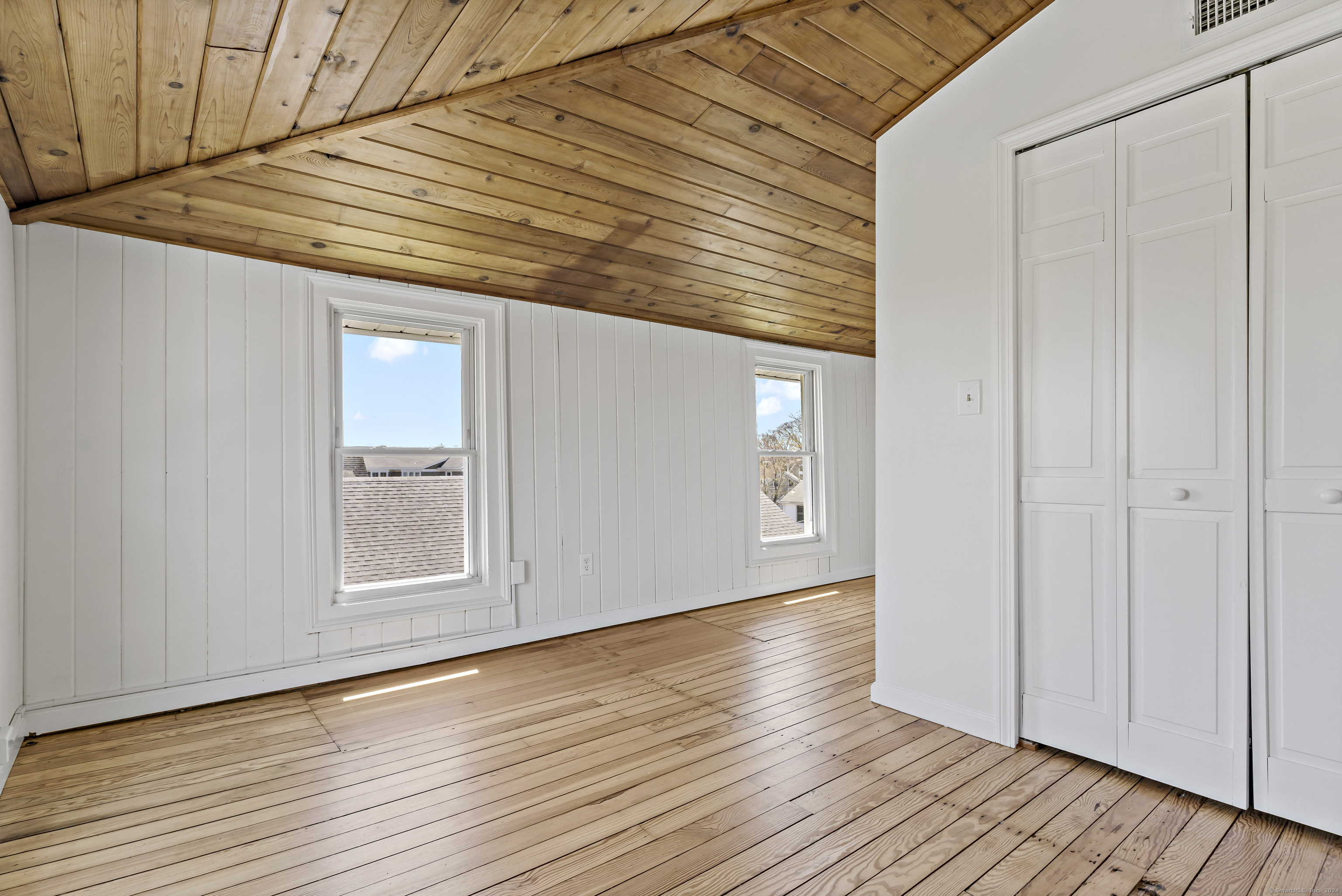 14 2nd Avenue Branford, CT 06405 - Photo 19 of 29 an empty room with wooden floor and windows