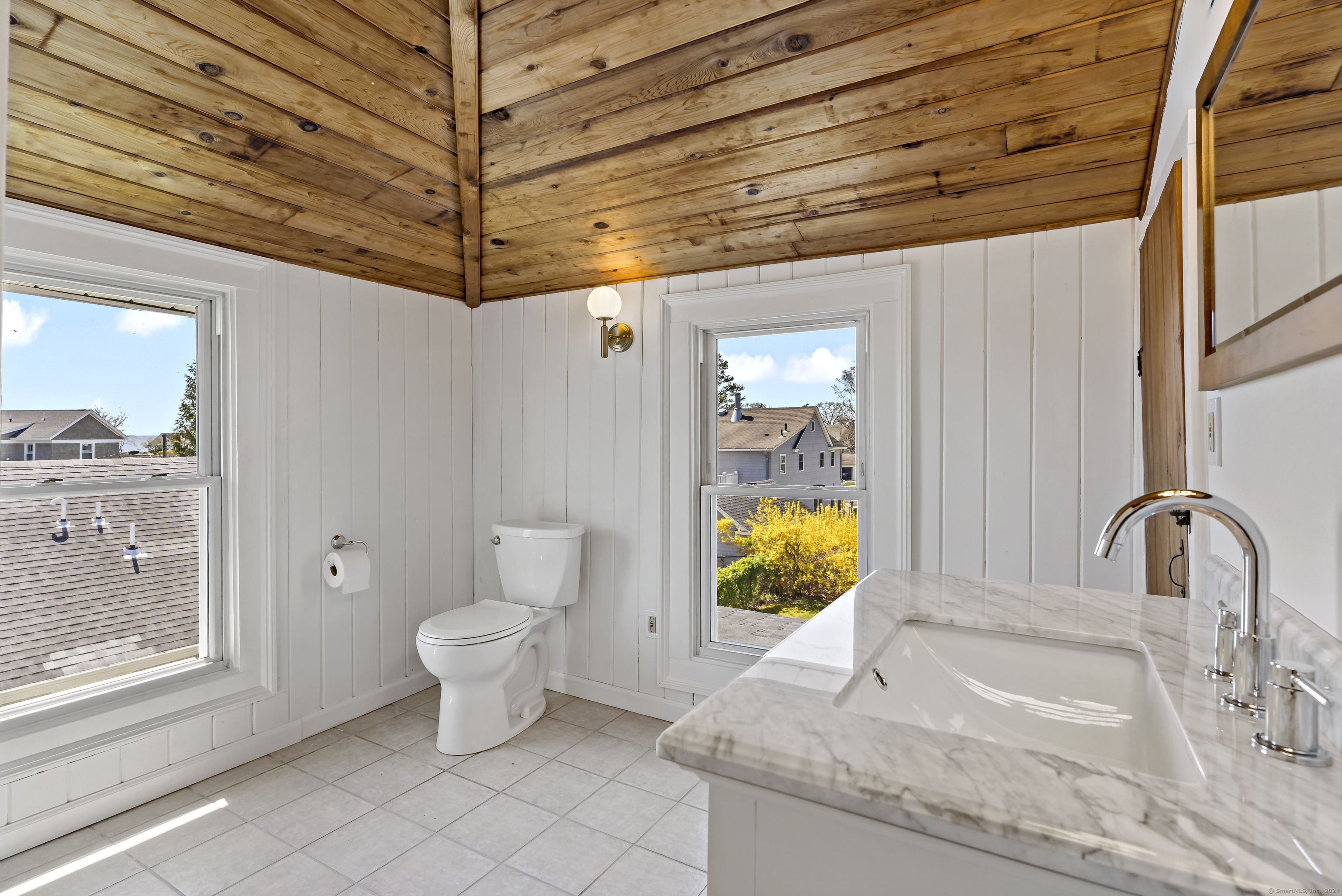 14 2nd Avenue Branford, CT 06405 - Photo 21 of 29 a bathroom with a granite countertop sink and a mirror