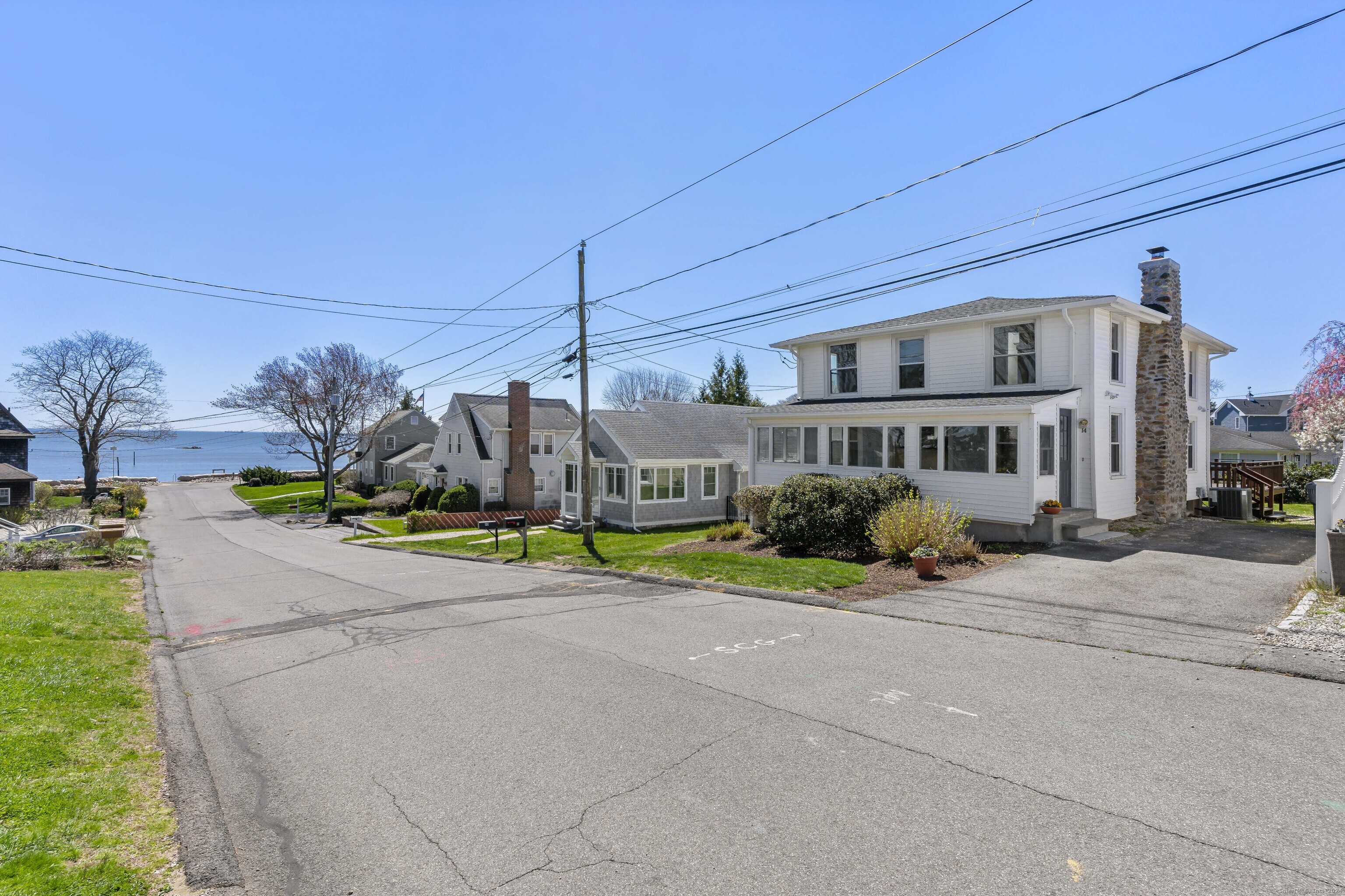 14 2nd Avenue Branford, CT 06405 - Photo 25 of 29 a front view of a house with a yard and outdoor seating