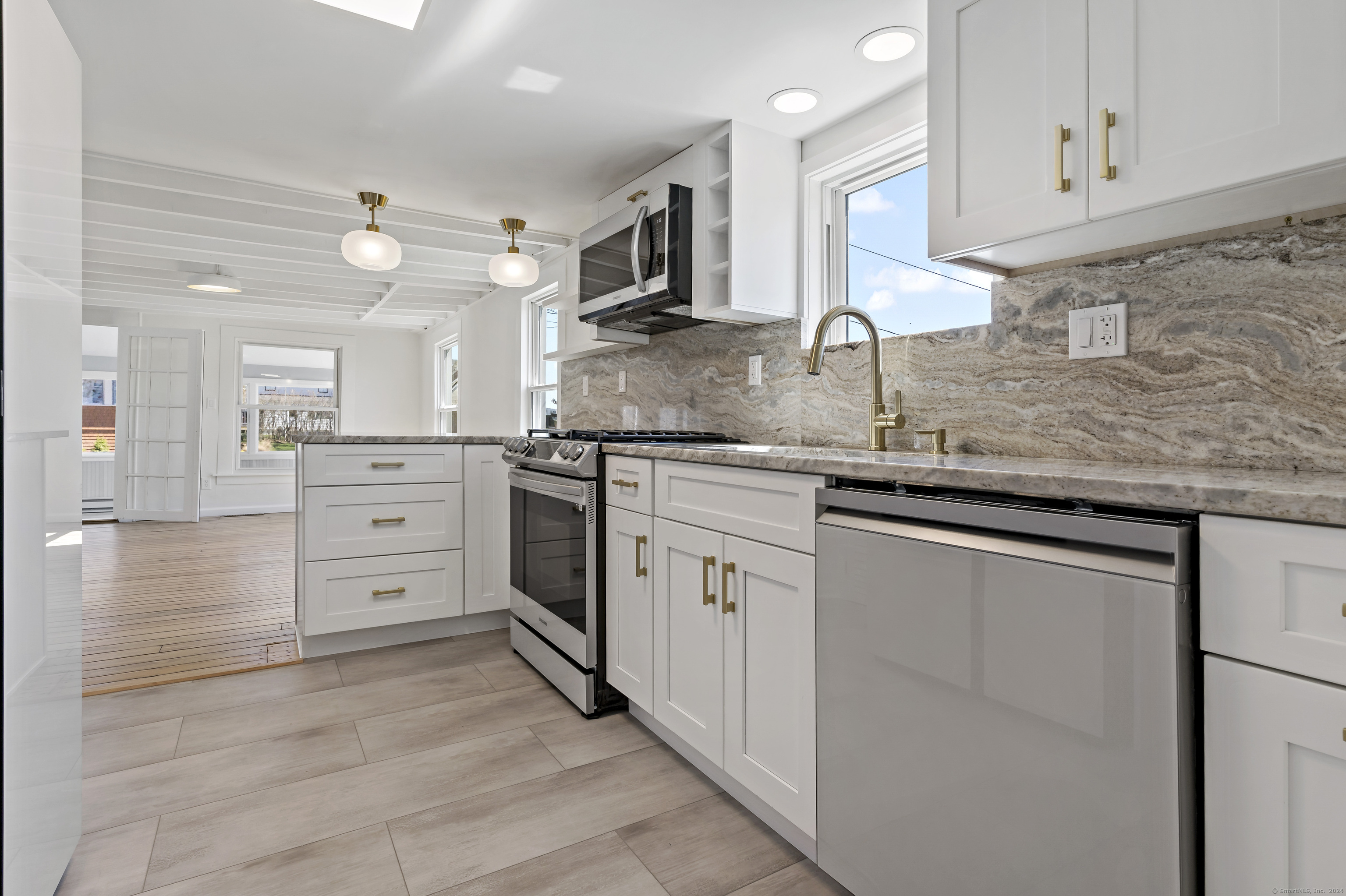 14 2nd Avenue Branford, CT 06405 - Photo 5 of 29 a kitchen with stainless steel appliances granite countertop a sink and cabinets