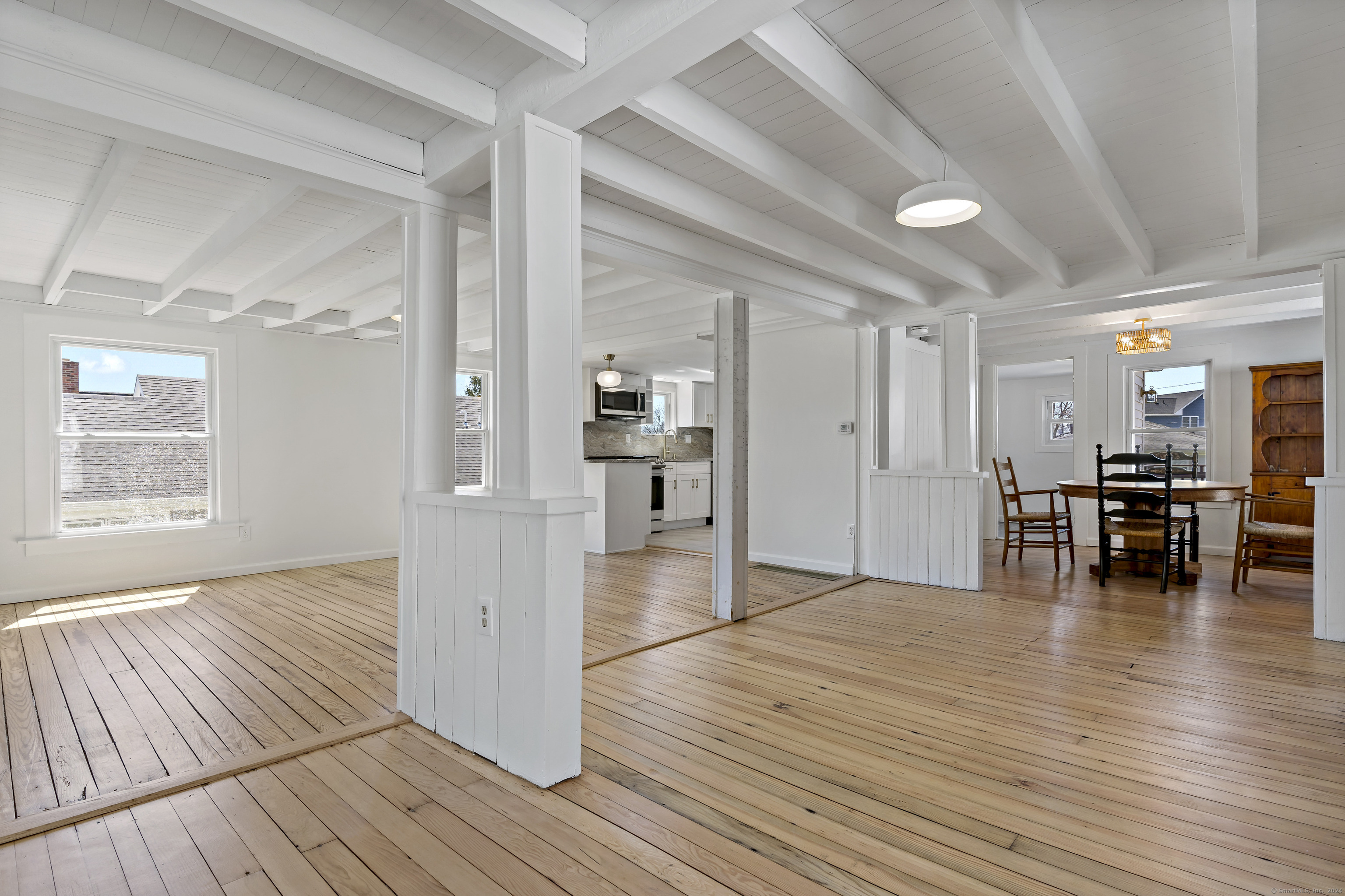 14 2nd Avenue Branford, CT 06405 - Photo 9 of 29 a view of empty room with wooden floor and kitchen view