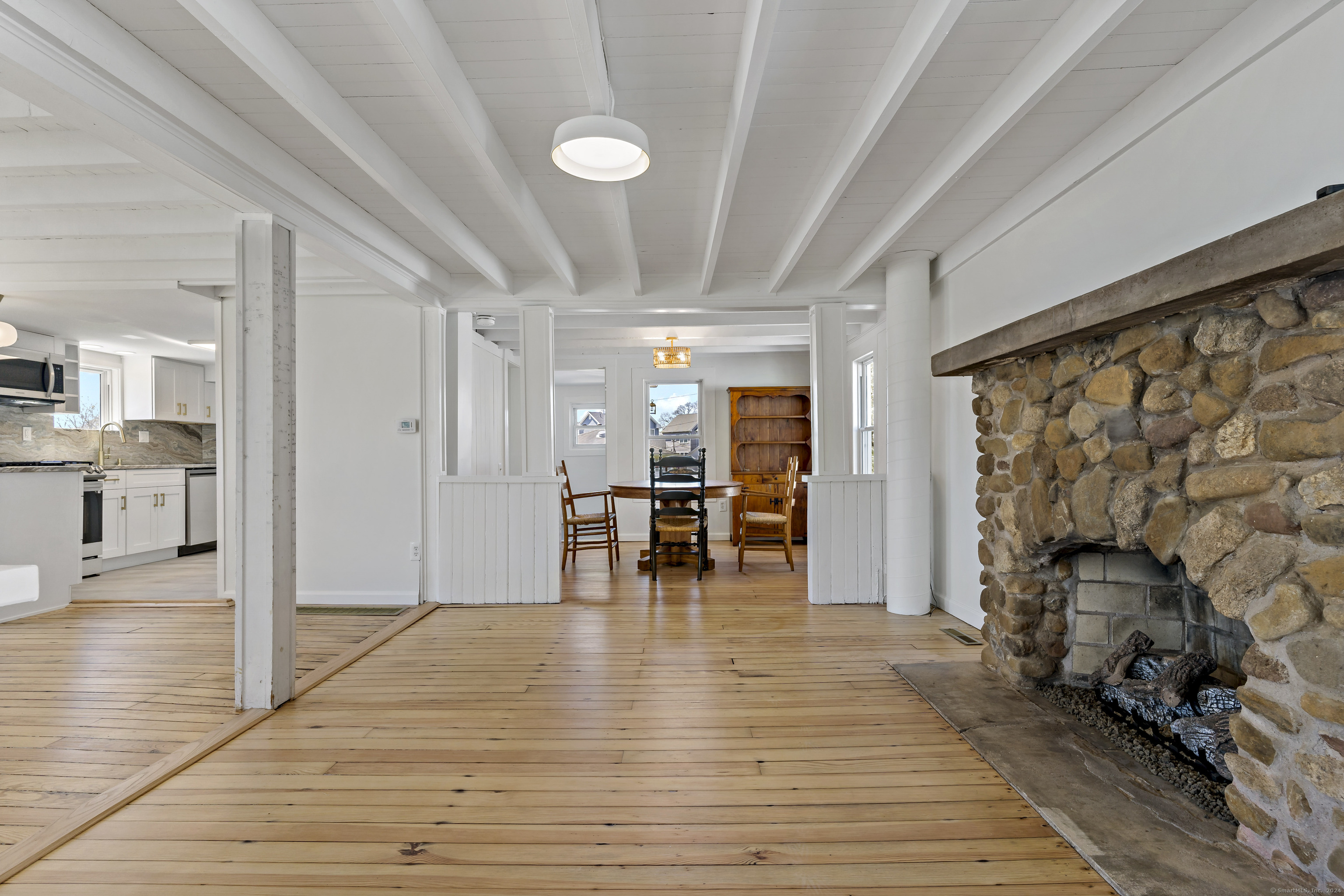 14 2nd Avenue Branford, CT 06405 - Photo 10 of 29 a view of empty room with wooden floor and fireplace