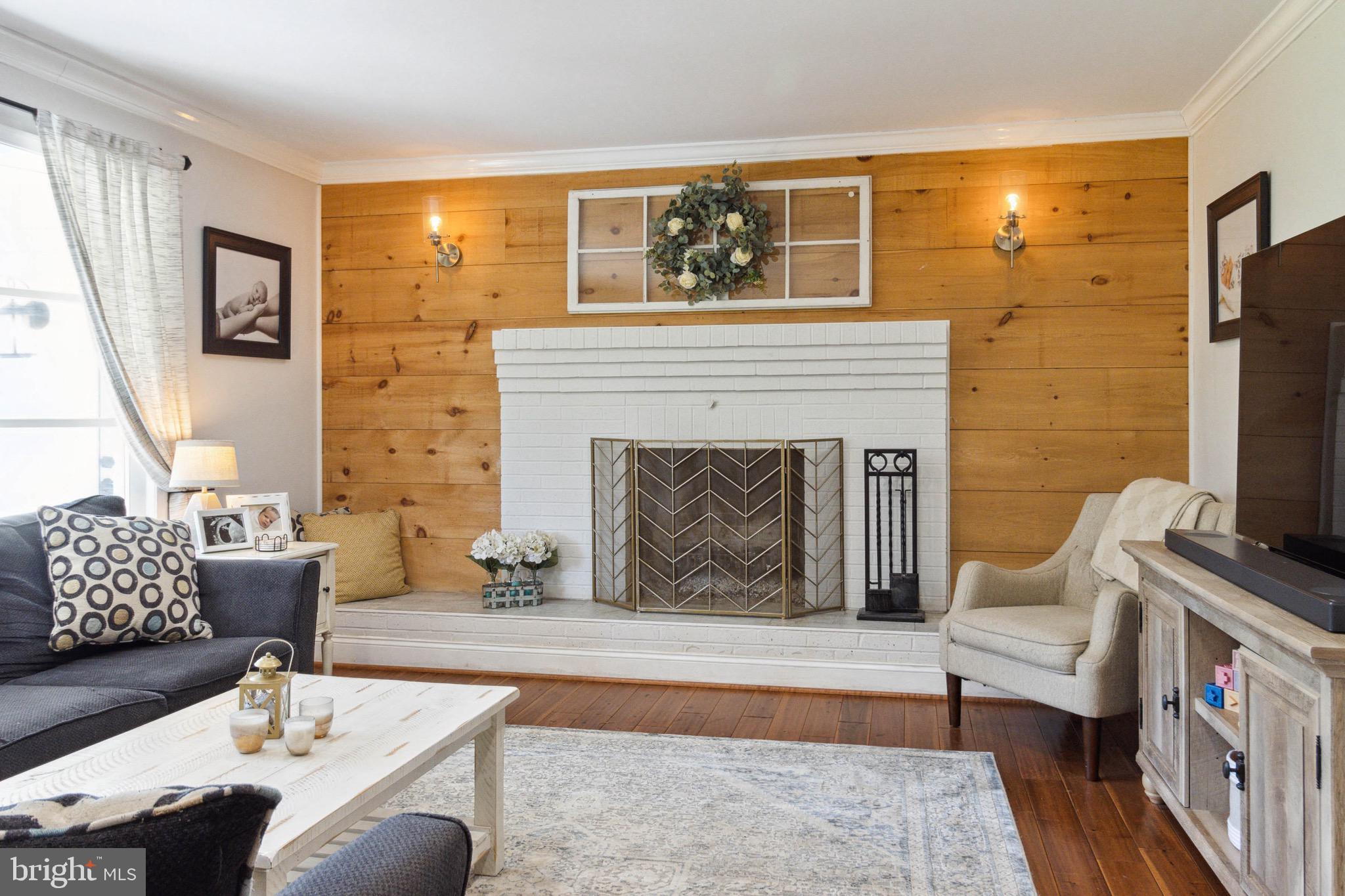 640 Deer Park Road Westminster, MD 21157 - Photo 9 of 35 Living Room w/ Wood Burning Fireplace and Shiplap