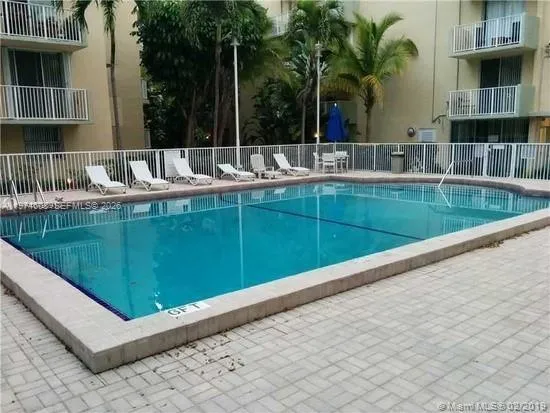 a view of swimming pool from a balcony