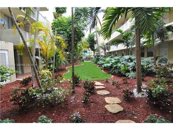 a view of a backyard of the house