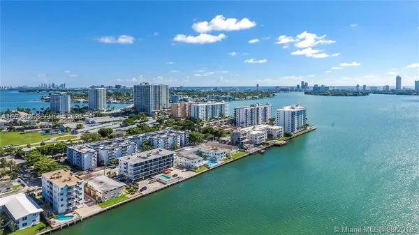 a view of a lake with a house in the background