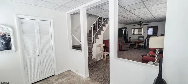 a view of living room with furniture and a window