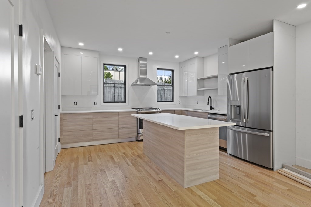 3 Pulaski Avenue Boston, MA 02127 - Photo 1 of 19 a kitchen with stainless steel appliances granite countertop a refrigerator and a sink