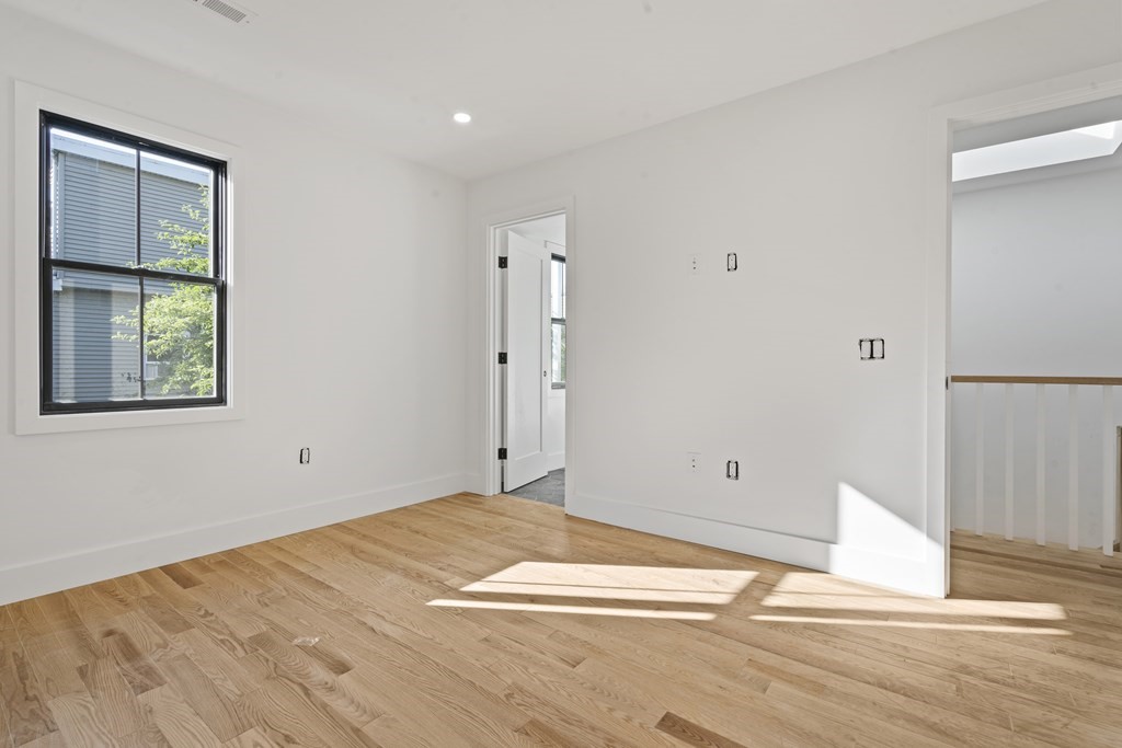 3 Pulaski Avenue Boston, MA 02127 - Photo 15 of 19 a view of a room with wooden floor and window