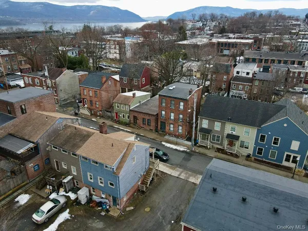 an aerial view of a house with a mountain view