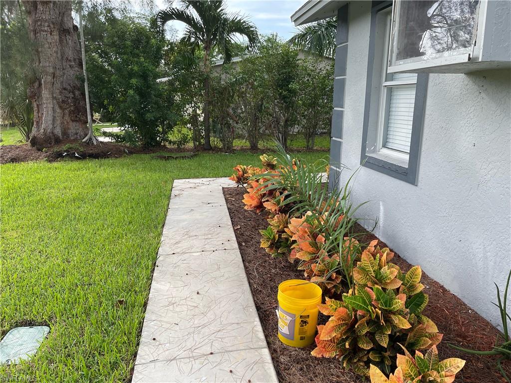 528 14th Street North Naples, FL 34102 - Photo 3 of 19 a view of a back yard of the house