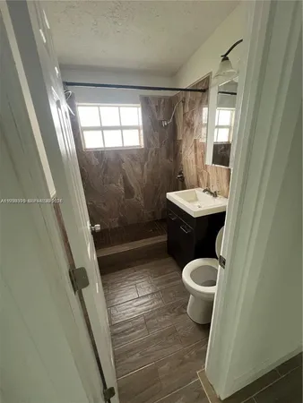 a bathroom with a sink and mirror
