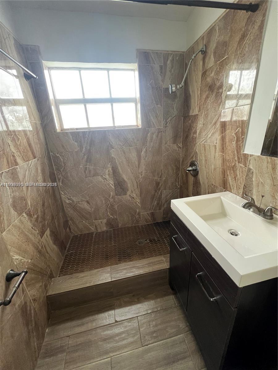 2240 Rutland Street Opa-Locka, FL 33054 - Photo 15 of 19 a bathroom with a sink and a mirror