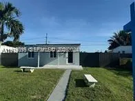 a swimming pool with barbeque oven