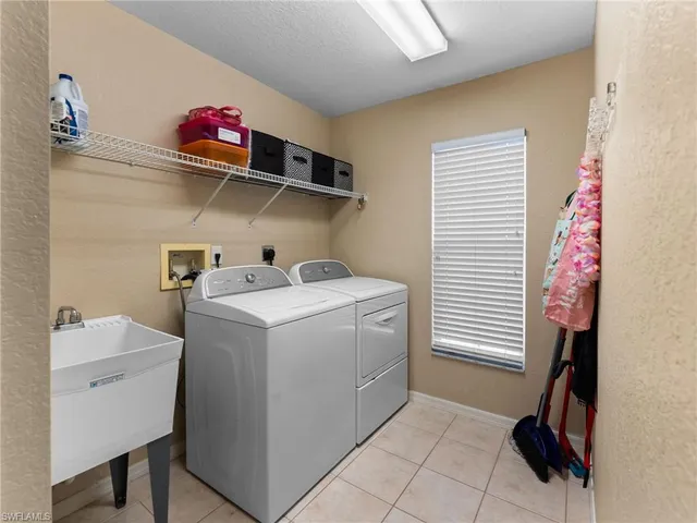 a view of storage and utility room with washer and dryer