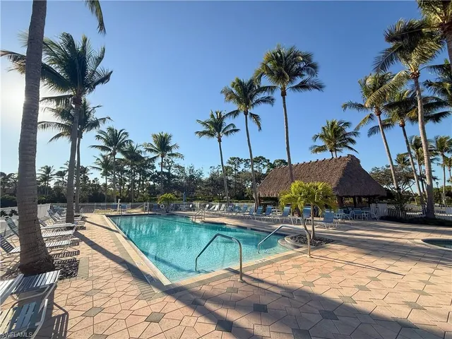 a house with palm tree in the background