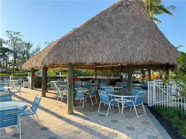 a patio with a table and chairs