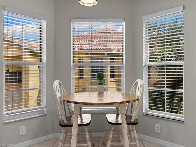 a dining room with furniture and window
