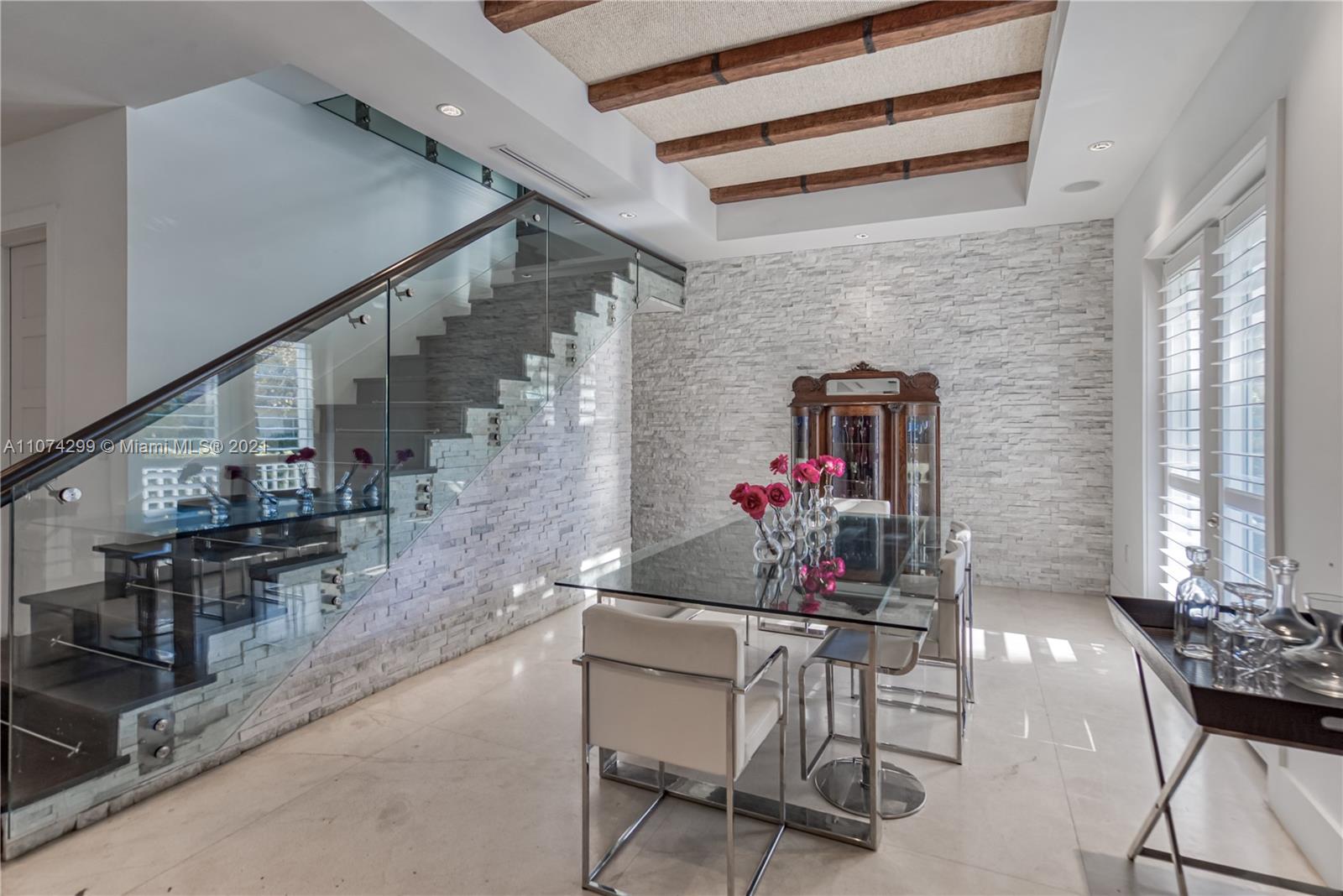 325 Hampton Lane Key Biscayne, FL 33149 - Photo 12 of 37 a dining room with furniture and entryway