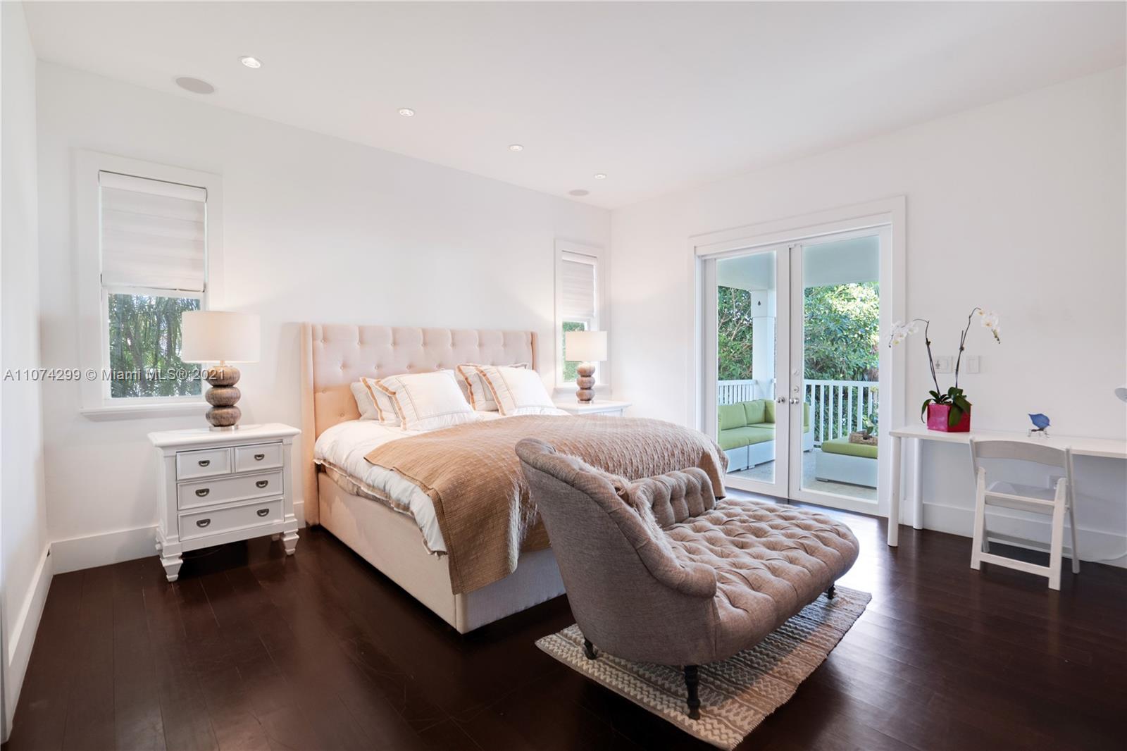 325 Hampton Lane Key Biscayne, FL 33149 - Photo 13 of 37 a bed room with a bed and a window