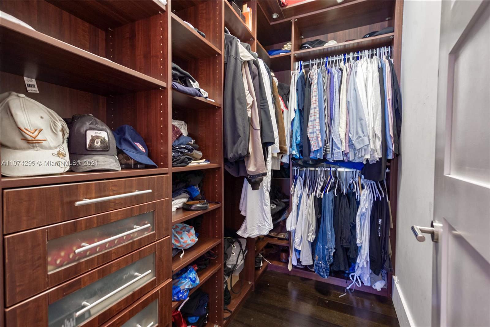 325 Hampton Lane Key Biscayne, FL 33149 - Photo 17 of 37 a view of walk in closet with clothes and shoes