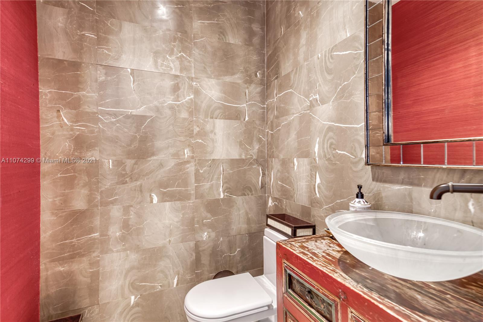 325 Hampton Lane Key Biscayne, FL 33149 - Photo 24 of 37 a bathroom with a sink toilet and shower