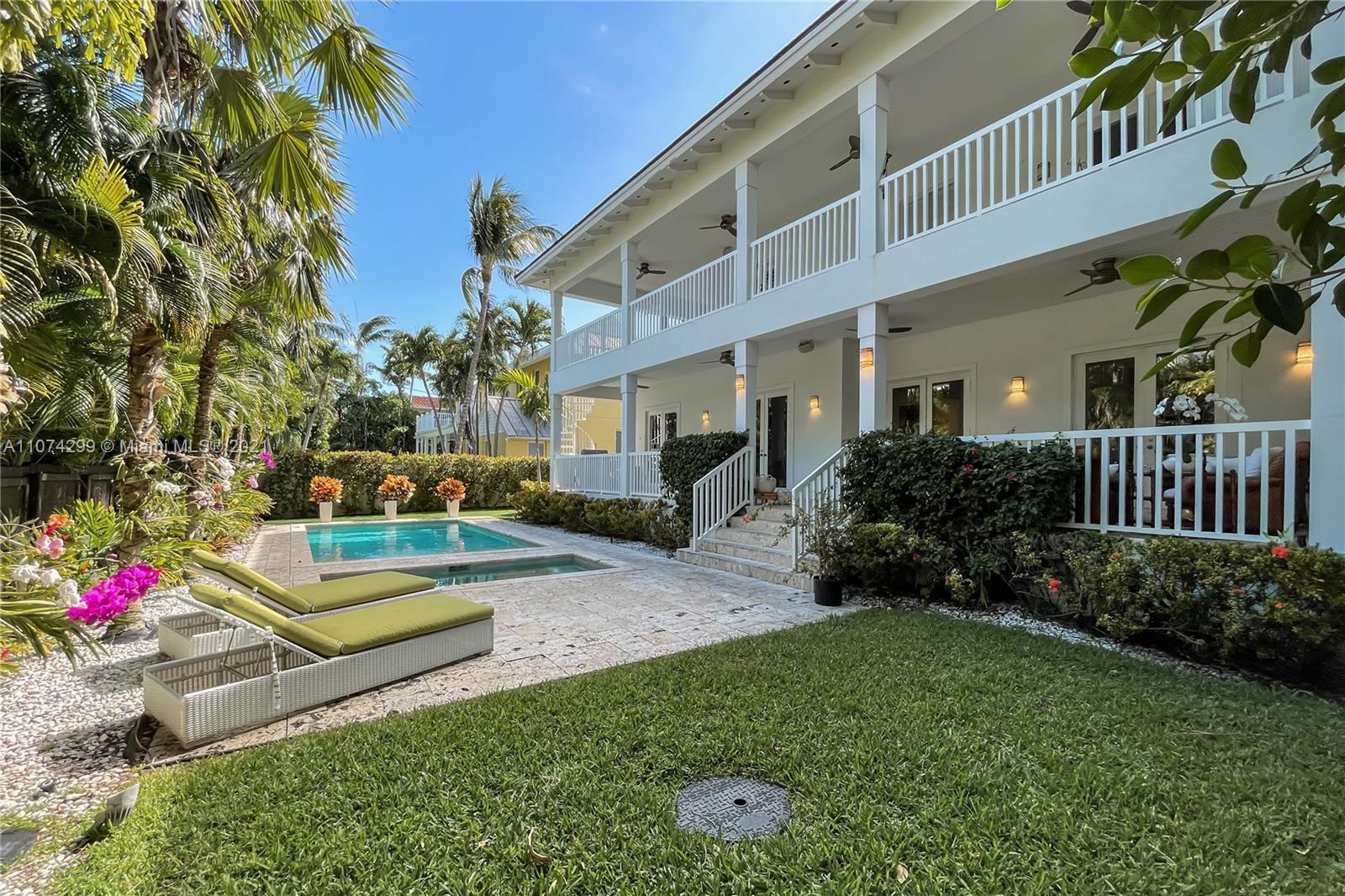 325 Hampton Lane Key Biscayne, FL 33149 - Photo 26 of 37 a view of a house with backyard and garden