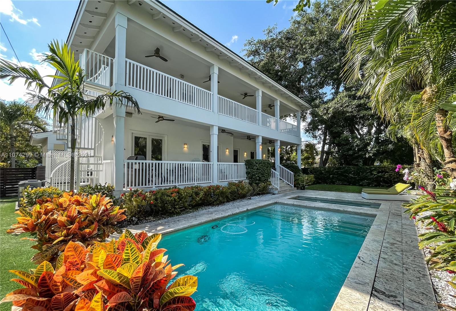 325 Hampton Lane Key Biscayne, FL 33149 - Photo 27 of 37 a front view of a house with swimming pool