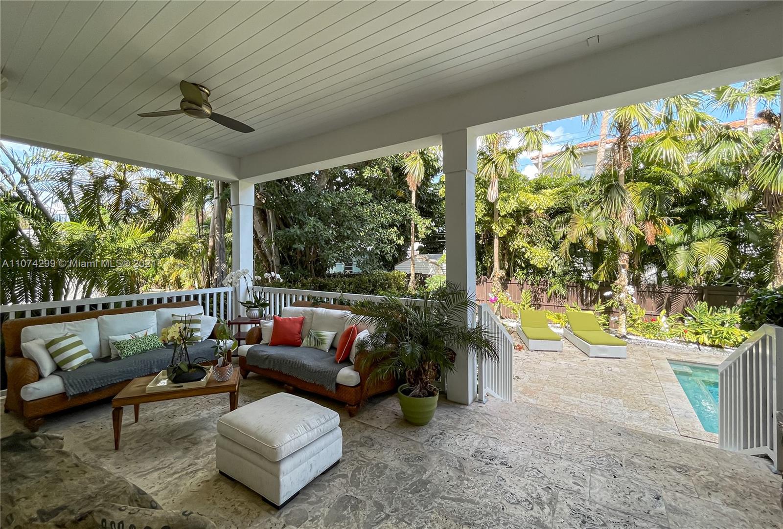 325 Hampton Lane Key Biscayne, FL 33149 - Photo 29 of 37 a living room with patio furniture and a potted plant