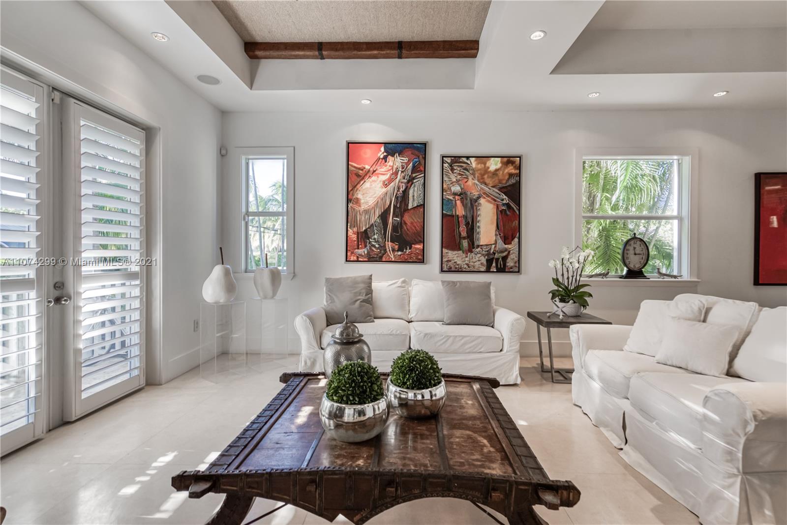 325 Hampton Lane Key Biscayne, FL 33149 - Photo 3 of 37 a living room with furniture large window and wooden floor