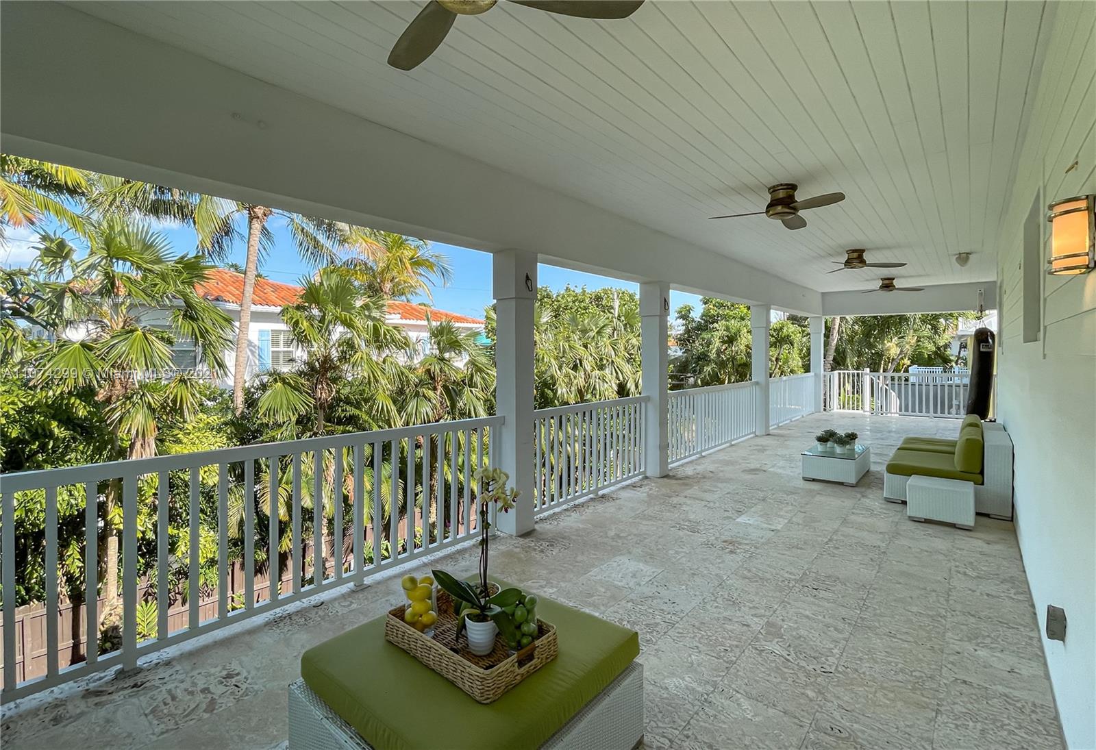 325 Hampton Lane Key Biscayne, FL 33149 - Photo 33 of 37 a living room with furniture and a floor to ceiling window