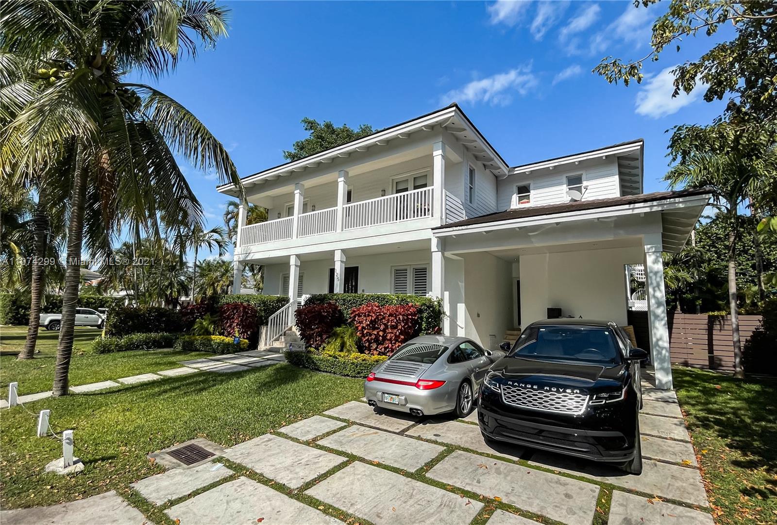 325 Hampton Lane Key Biscayne, FL 33149 - Photo 37 of 37 a front view of a house with a garden