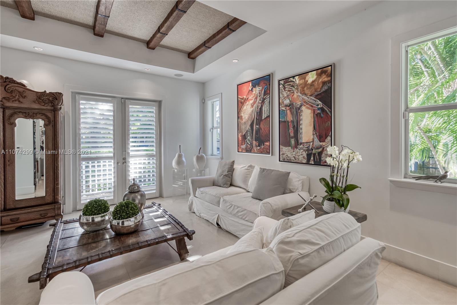 325 Hampton Lane Key Biscayne, FL 33149 - Photo 4 of 37 a living room with furniture and a large window