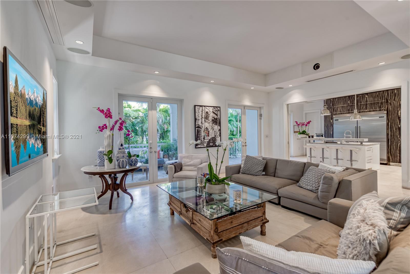 325 Hampton Lane Key Biscayne, FL 33149 - Photo 8 of 37 a living room with furniture dining area and a flat screen tv